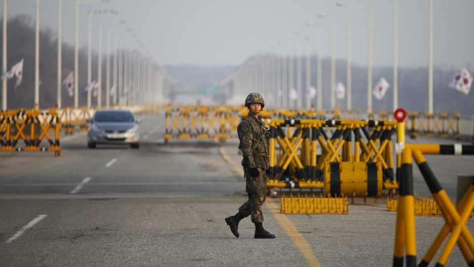 A South Korean soldier patrols at a checkpoint on the Grand Unification Bridge, which leads to the demilitarized zone separating North Korea from South Korea, in Paju, north of Seoul, April 8, 2013.